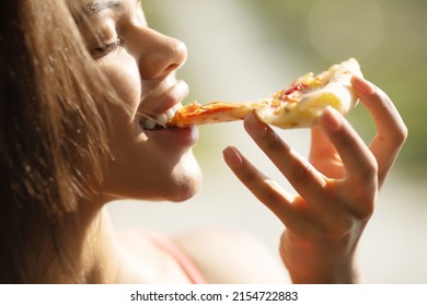 Black Woman Hand Takes A Slice Of Meat Pizza. Young Woman Eating Pizza Outdoor In Street.