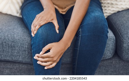 Black Woman, Hands And Knee Injury Pain For Person On House Living Room Sofa Or Home Interior Lounge. Zoom On Healthcare, Wellness Or Medical Surgery Burnout, Stress And Legs Muscle Accident On Couch