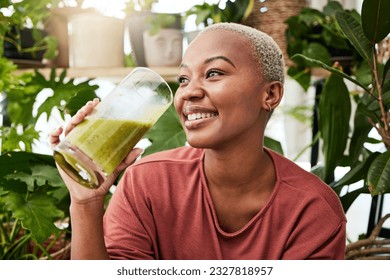 Black woman, healthy and green smoothie with nutrition for detox or smile with wellness in home. Vegan, drink and girl for natural beverage or smoothie for diet with healthy fruits or plant for juice