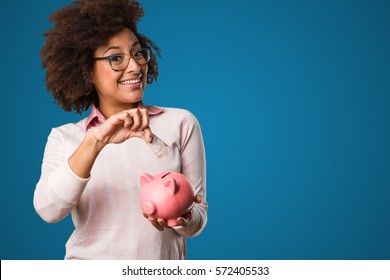 Black Woman Holding A Piggy Bank And Bills