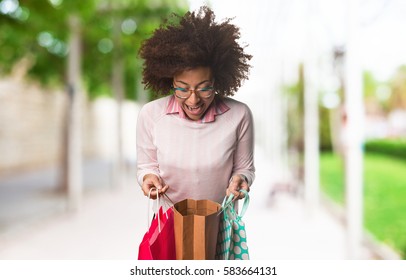 Black Woman Holding Shopping Bags