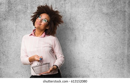 Black Woman Holding Shopping Basket