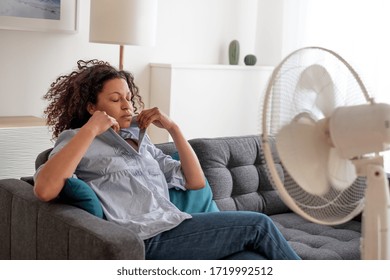 Black Woman At Home Refreshing During Summer Haze