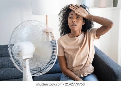 Black Woman At Home Refreshing During Summer Haze