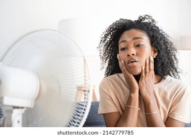 Black Woman At Home Refreshing During Summer Haze