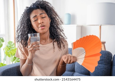 Black Woman At Home Refreshing During Summer Haze