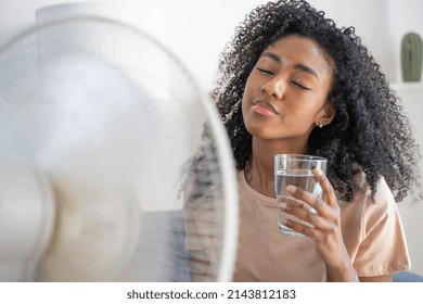 Black Woman At Home Refreshing During Summer Haze