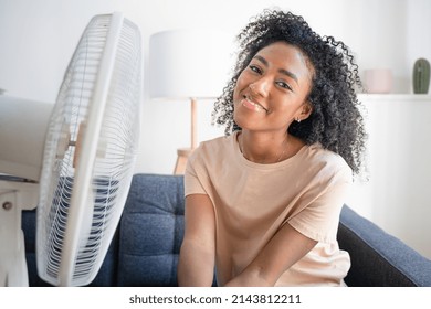 Black Woman At Home Refreshing During Summer Haze Smiling