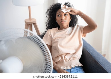 Black Woman At Home Refreshing During Summer Haze