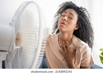 Black Woman At Home Refreshing During Summer Haze