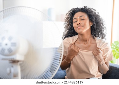 Black Woman At Home Refreshing During Summer Haze