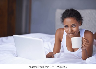 Black woman, laptop or coffee in bed to relax, scroll or search on internet, social media or network. Female influencer, tea or smile as checking, message or email for viral meme and blog post