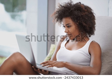 Black woman, laptop or relax to scroll, social media or blog as article, meme or digital communication. Happy, female writer or blogger on computer as typing browsing or search of viral gif online