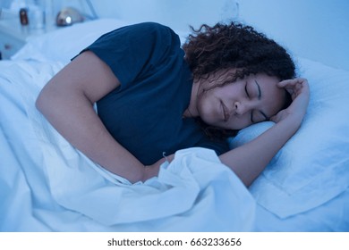 Black Woman Lying In Her Bed Trying To Sleep