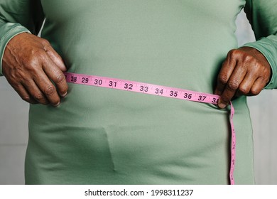 Black Woman Measuring Her Tummy