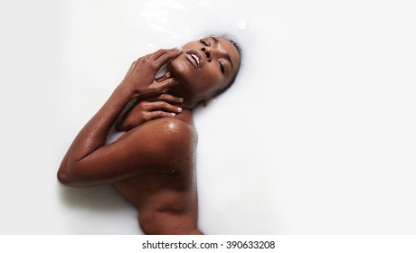 Black Woman In A Milk Bath Treatment