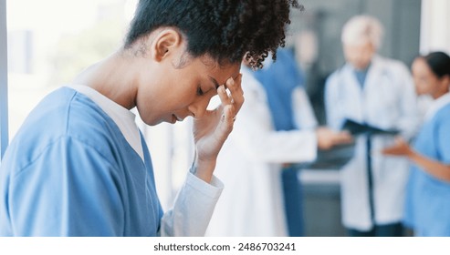 Black woman, nurse and anxiety in burnout, grief or mistake against glass window in hospital building. Frustrated physician, medical healthcare and person in stress, loss or headache at clinic - Powered by Shutterstock