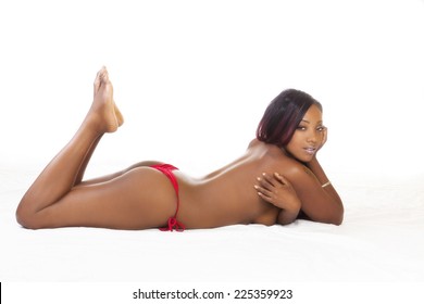 Black Woman On Stomach Topless Red Bikini
