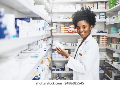 Black woman, pharmacist and portrait with product in clinic for medicine stock, reading and check information on label. Smile, female person and pills box for medical inventory, inspection and retail - Powered by Shutterstock