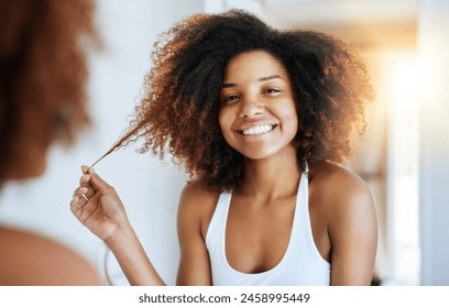 Black woman, portrait and bathroom mirror for hair care or morning routine with shampoo, wellness or texture. Female person, face and curly afro in reflection for soft treatment, home or happiness - Powered by Shutterstock