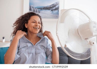 Black Woman Portrait Cooling Off At Home During Summer Heat