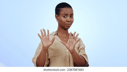Black woman, portrait and hands for no, rejection or refusal isolated against a blue studio background. Face of worried African female person or model in stop, halt or not interested on mockup space