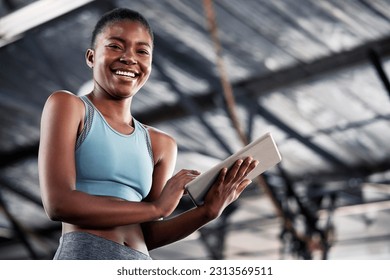 Black woman, portrait or personal trainer with a tablet for fitness training, workout or sports exercise. Results, digital technology app or happy gym instructor planning a online coaching schedule - Powered by Shutterstock