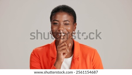 Black woman, portrait and silence wink in studio, confidential mystery and white background. Female person, shush and gesture for quiet communication, shut up and secret privacy or stop revelation