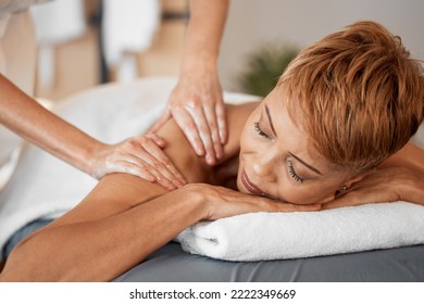 Black Woman, Relax And Massage Being Peaceful, Calm And Enjoy Stress Relief Laying On Table. Mature Female, At Luxury Spa And Massage Therapist For Wellness, Body Care And Physical Therapy Treatment.