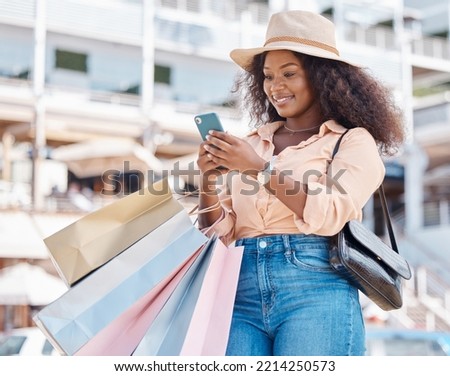Black woman, retail shopping bag and city smartphone search fashion sales, social media and online newsletter, discount code and store promotions. Wealthy customer using phone on ecommerce mobile app