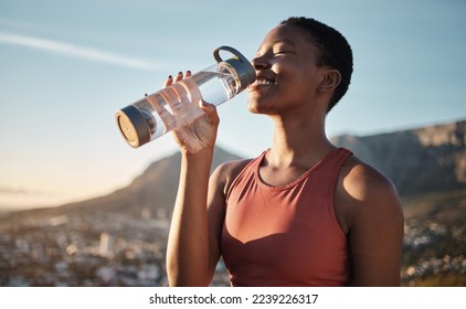 Black woman, runner and drinking water for outdoor exercise, training workout or marathon running recovery. African woman, healthy athlete and hydrate with bottle for fitness, health and cardio run - Powered by Shutterstock