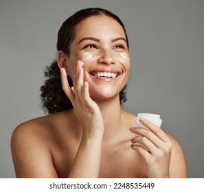 Black woman, smile and face beauty cream for skincare wellness shine, cosmetics dermatology and salon spa product in studio. African girl, spf lotion and self care happiness for luxury facial glow - Powered by Shutterstock