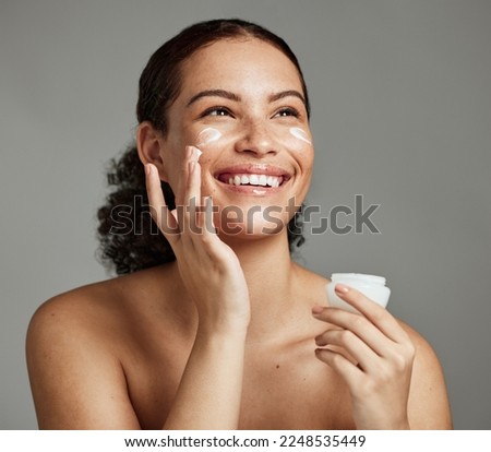 Black woman, smile and face beauty cream for skincare wellness shine, cosmetics dermatology and salon spa product in studio. African girl, spf lotion and self care happiness for luxury facial glow