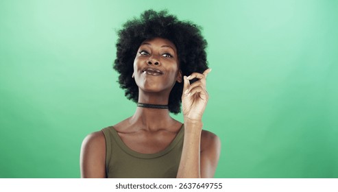 Black woman, thinking or solution with afro on green background for problem solving in studio. Female person, thinker and African model with good decision for idea, question or answer on mockup space