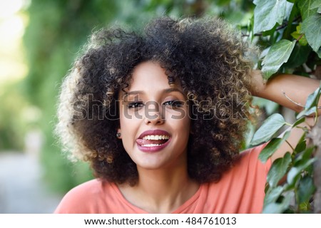 black woman tongue out urban park stock photo edit now 484761013