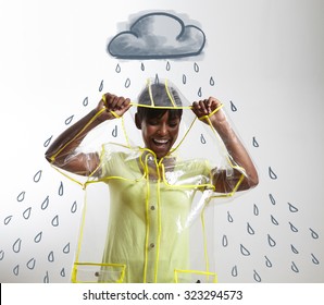 Black Woman In Transparent Raincoat With Drawn Rain And Cloud