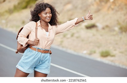 Black Woman, Travel And Thumbs Up On The Road For Lift In Nature For Assistance, Help Or Trip In The Outdoors. African American Female Traveler Or Hitch Hiker With Roadside Hand Gesture For Transport