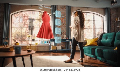 Black Woman Using Virtual Reality Headset for Online Shopping, Browsing through Dresses and Clothing items. Ordering from Mock-up Internet Store App for e-Commerce products. Augmented Reality - Powered by Shutterstock