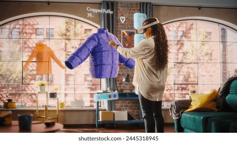 Black Woman Using Virtual Reality Headset for Online Shopping, Browsing through Cool Seasonal Sports items. Ordering from Mock-up Internet Store for e-Commerce products. Augmented Reality