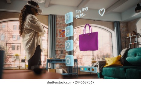 Black Woman Using Virtual Reality Headset for Online Shopping, Browsing through Cool Handbags items. Ordering from Mock-up Internet Store App for e-Commerce products. Augmented Reality Application - Powered by Shutterstock