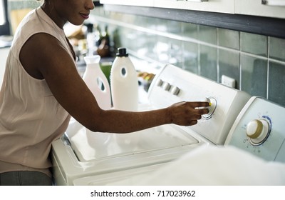 Black Woman Using Washing Machine