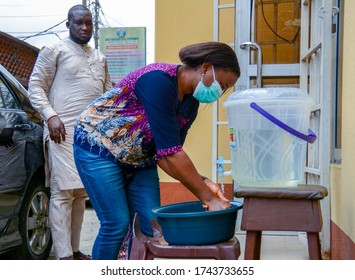 A Black Woman Washes Her Hand At A Makeshift Handwashing System, Regular Hand Washing Has Been Promoted To Help Curb The Spread Of Covid-19, Lagos Nigeria, April 12, 2020.