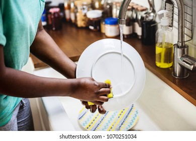 Black Woman Washing The Dish