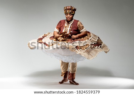 Black woman, wearing a African religion dress in Brazil, representing Orisha.