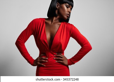 black woman wearing red dress and short hair