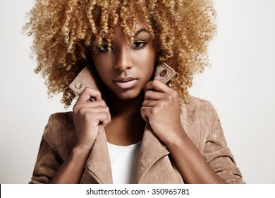 Black Woman Wears Beige Jacket, Curly Hair