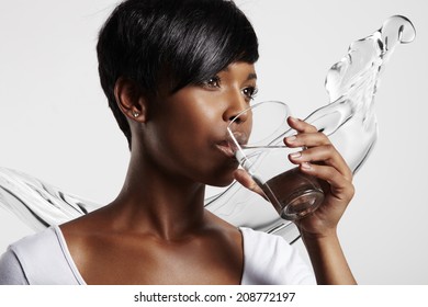 Black Woman In White T-shirt Drinking Water