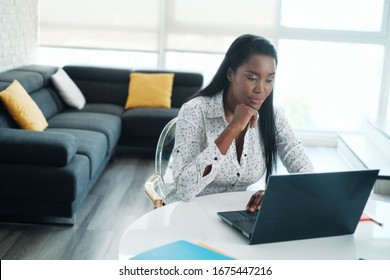 Black Woman Working From Home With Laptop Computer
