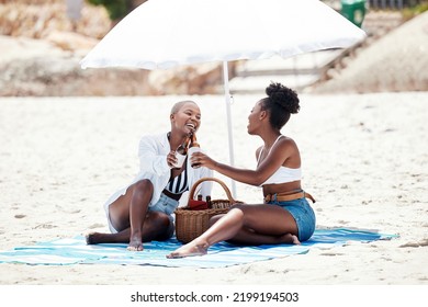 Black Women, Friends And Cheers With Beer On A Beach In Nature On A Hangout, Vacation Or Holiday. Drinking, Happy African Girls And A Smile With Refreshing Alcohol, Beverage Or Liquor By The Shore.