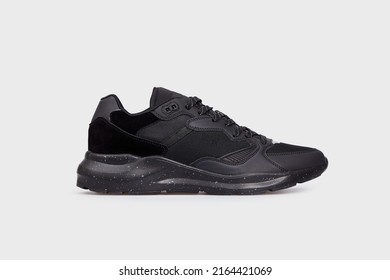 Black women's classic basic basketball sneaker with high sole. Blank female sports shoe, boot isolated on white background. Footwear, casual leather training shoe. Template, mock up